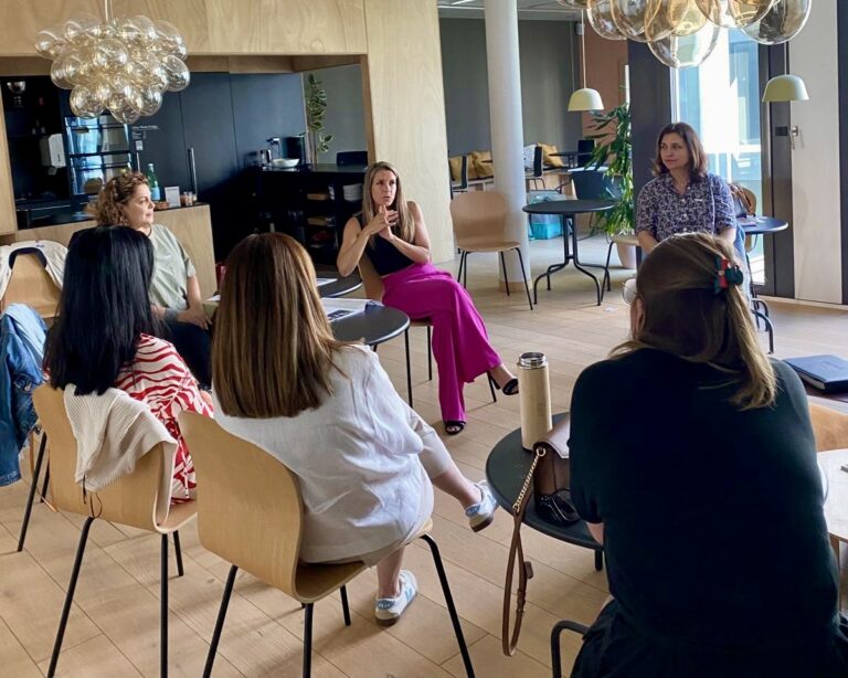 Alice Ekonomou leading the Own the Room workshop with GLOW, guiding participants through voice, breath, and presence techniques.