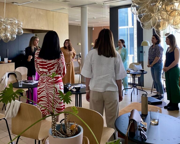 Alice Ekonomou leading the Own the Room workshop with GLOW, guiding participants through voice, breath, and presence techniques.