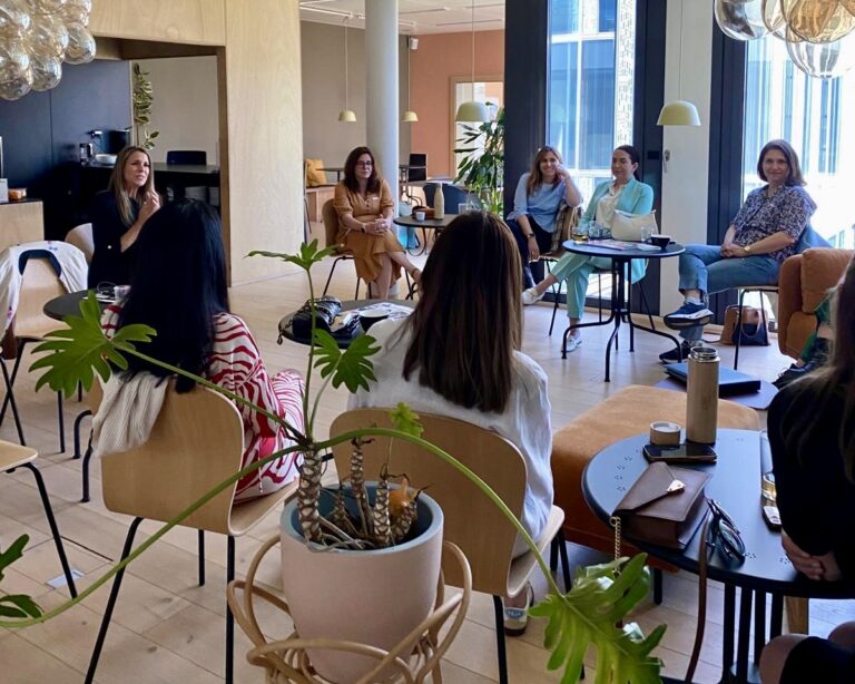 Alice Ekonomou leading the Own the Room workshop with GLOW, guiding participants through voice, breath, and presence techniques.